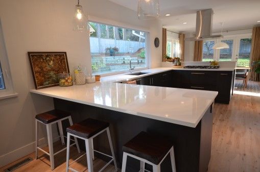 U-Shaped kitchen with a large window.